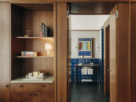 Château Royal hotel room interior, closet and open bathroom door